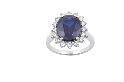 Lot 2238 - A Sapphire and Diamond Cluster Ring the oval...