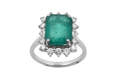 Lot 2291 - An Emerald and Diamond Cluster Ring the...