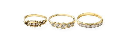 Lot 354 - An 18 Carat Gold Diamond Half Hoop Ring,...