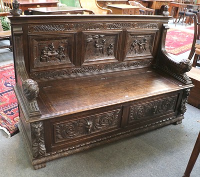 Lot 1408 - A Victorian Oak Box Settle, heavily carved...