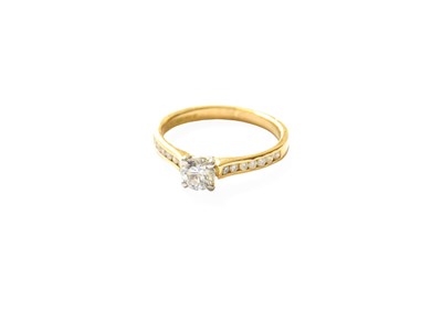 Lot 335 - An 18 Carat Gold Diamond Solitaire Ring, the...