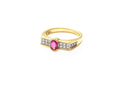 Lot 329 - A Ruby and Diamond Ring, the oval cut ruby in...