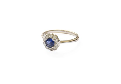 Lot 410 - An 18 Carat White Gold Sapphire and Diamond...