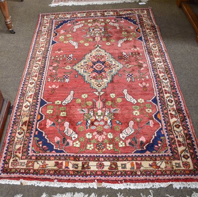 Lot 1171 - An Indian Rug, the ivory field with columns or...