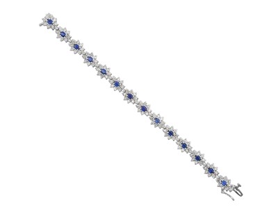 Lot 2245 - A Sapphire and Diamond Cluster Bracelet...