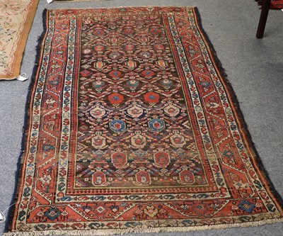 Lot 1011 - Kurdish Rug, the charcoal brown field of boteh...