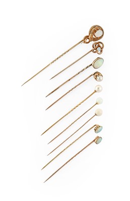 Lot 9 - Seven Opal Stick Pins, of varying designs,...