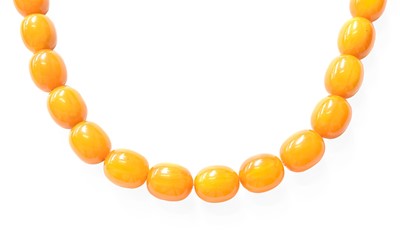 Lot 422 - An Amber Bead Necklace, comprising of ninteen...