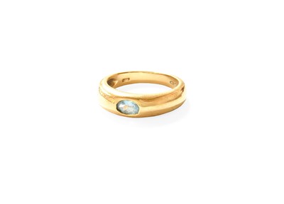 Lot 416 - A Blue Topaz Ring, the yellow tapered band...