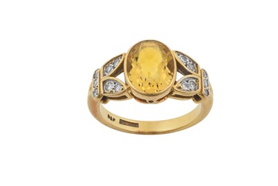 Lot 2397 - An 18 Carat Gold Yellow Beryl and Diamond Ring...