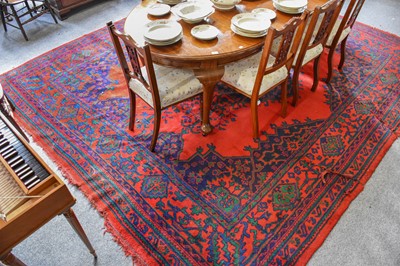 Lot 1154 - A Maple & Co. Turkey Carpet, the crimson field...