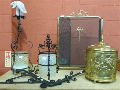 Lot 676 - Pair of wrought iron lamps with vaseline glass shades on brackets, brass coal bucket and cover,...