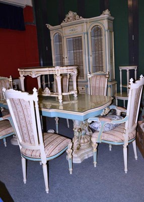 Lot 680 - A modern cream gilt and floral decorated dining room suite comprising table, six chairs,...