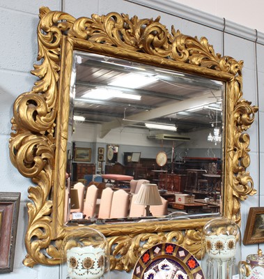 Lot 1266 - A Large Baroque Carved Giltwood Wall Mirror,...