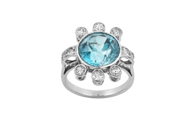 Lot 2264 - A Blue Zircon and Diamond Ring the round cut...