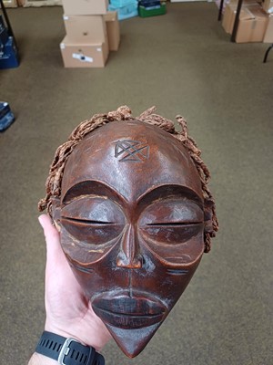 Lot 184 - A Chokwe Pwo Wood Mask, with plaited and...