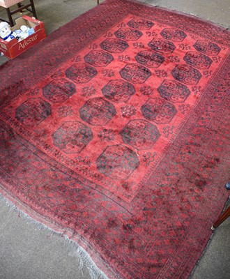 Lot 1167 - Afghan Turkmen Carpet, the claret field with...