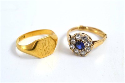 Lot 19 - A ring stamped '22CT' and a white and blue stone dress ring (2)
