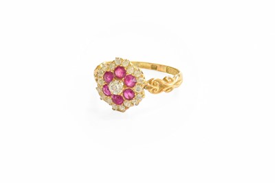 Lot 150 - A Ruby and Diamond Cluster Ring, the central...