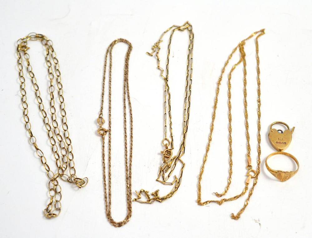 Lot 22 - Four necklaces stamped to clasps '375' and '9K'; a 9ct gold small lock; and a yellow metal...