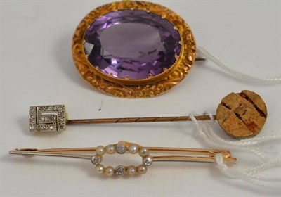 Lot 23 - An amethyst brooch, pearl and diamond bar brooch and a diamond tie pin (3)