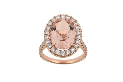 Lot 2332 - A Morganite and Diamond Cluster Ring the oval...