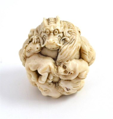 Lot 25 - Ivory netsuke modelled as a ball of animals, 4.5cm