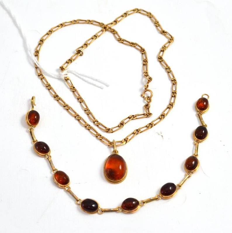 Lot 26 - An amber set bracelet and a figaro link chain with amber pendant