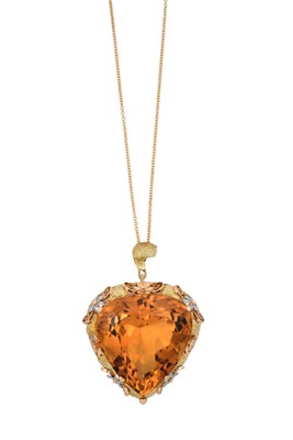 Lot 2357 - A Citrine Pendant on Chain the triangular...