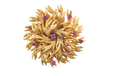 Lot 2402 - A 9 Carat Gold Ruby Brooch the radial textured...