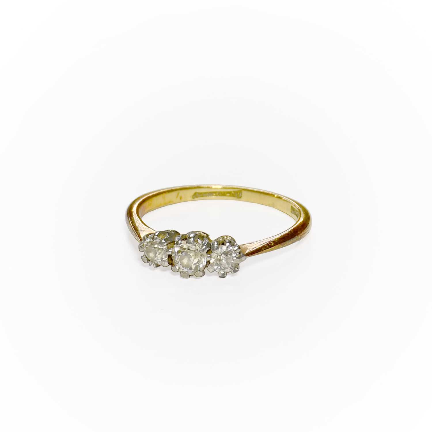 Lot 25 - A Diamond Three Stone Ring, the graduated old...