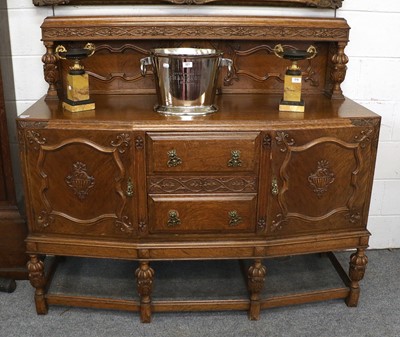 Lot 1374 - A 20th Century Carved Oak Dining Suite,...