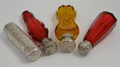 Lot 37 - Four Victorian silver scent bottles, three with cut glass phials and silver coloured mounts and...