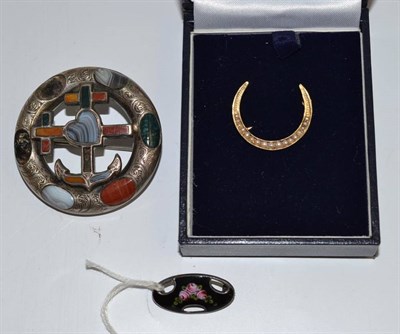 Lot 50 - A Scottish hardstone brooch, an enamelled brooch by Charles Horner and a seed pearl set...