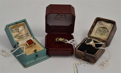 Lot 54 - A Cornelian set signet ring, a bloodstone set signet ring, a mourning ring