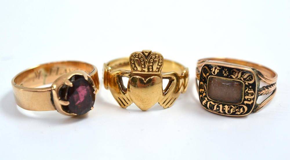 Lot 60 - A 9ct gold garnet set ring, a 9ct gold Claddagh ring and a mourning ring (3)