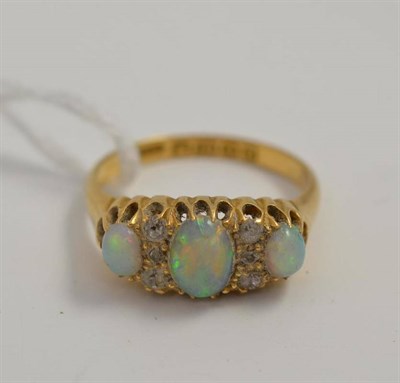 Lot 61 - An 18ct gold opal and diamond ring