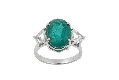 Lot 2258 - An Emerald and Diamond Three Stone Ring the...