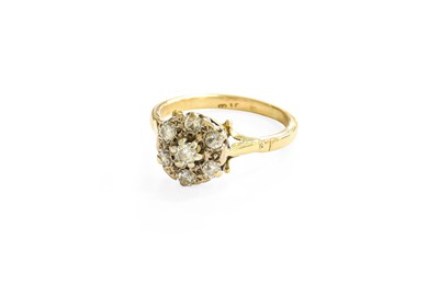 Lot 154 - A Diamond Cluster Ring, the central raised...