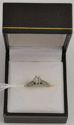 Lot 65 - A diamond solitaire ring, with stone set shoulders, stamps '18CT', estimated diamond weight...