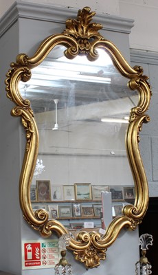 Lot 1189 - A Reproduction Gilt Framed Mirror, in roccoco...