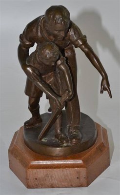 Lot 80 - Bronze group of a father and son playing cricket