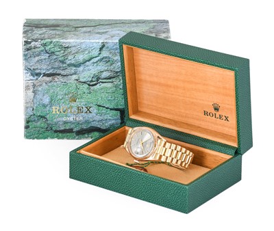 Lot 2187 - Rolex: An 18 Carat Gold Automatic Day/Date...
