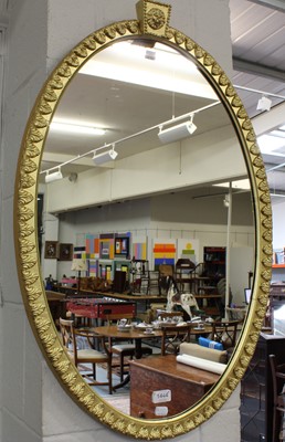 Lot 1444 - A Regency Gilt Framed Oval Mirror, 56cm by 84cm