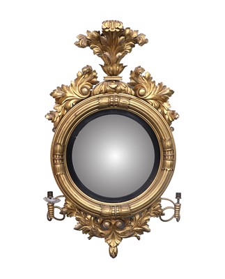 Lot 794 - A Regency Giltwood and Ebonised Convex Mirror,...