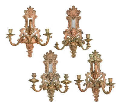 Lot 629 - A Harlequin Set of Four Bronze Wall Sconces,...