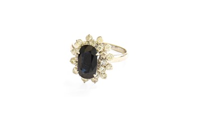 Lot 175 - A Sapphire and Diamond Cluster Ring, the...