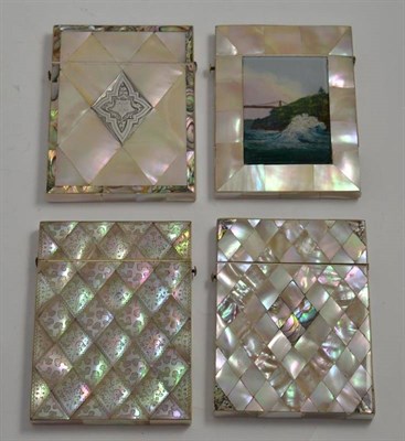 Lot 162 - A mother of pearl card case with engraved decoration, another set with a reverse painted glass...