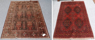 Lot 1150 - Afghan Turkmen Rug, the deep terracotta field...