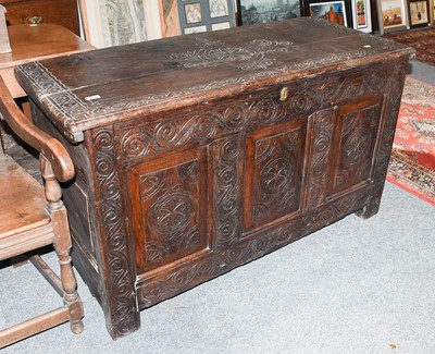 Lot 1419 - An 18th Century Carved Oak Chest, with hinged...